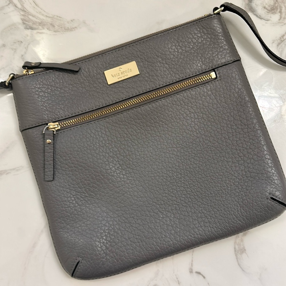 Kate Spade cross body bag. All leather. Grey. Zip pockets.